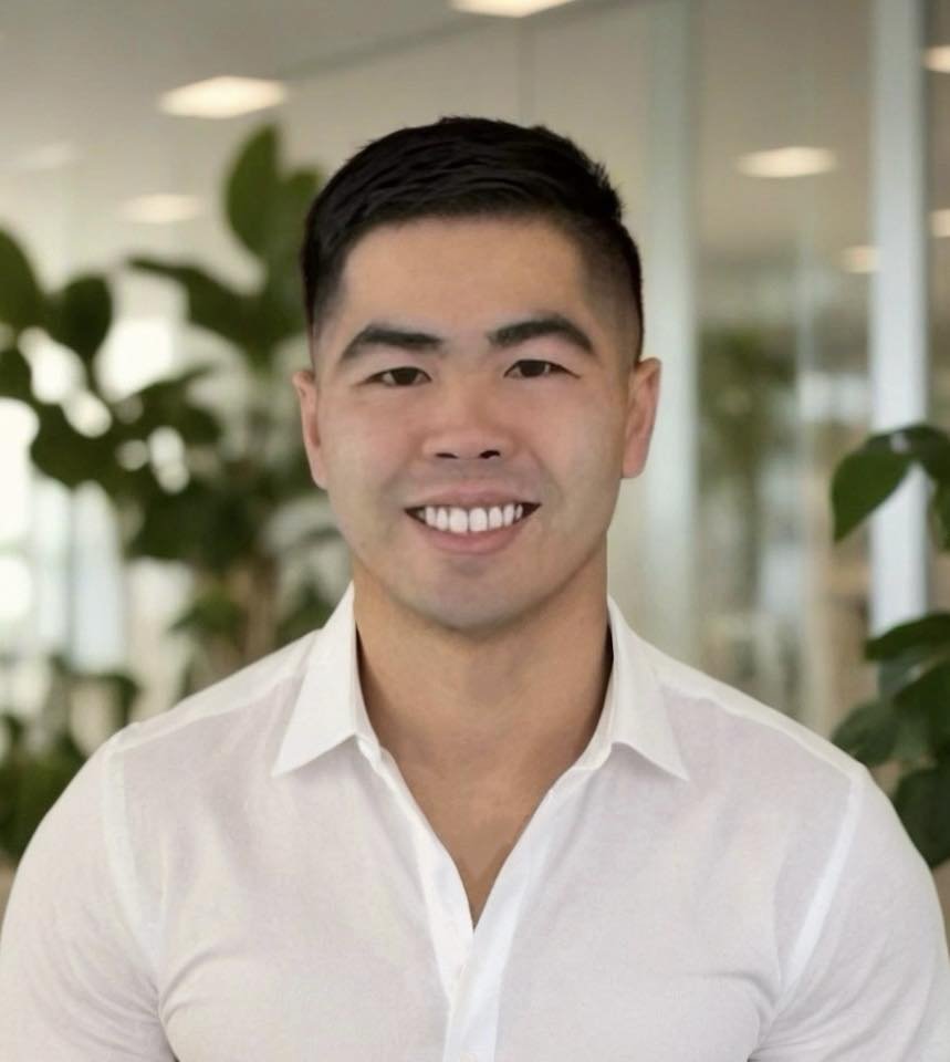 Dr. David Dao, DDS — founder of Dao Dental Group, smiling in a white shirt